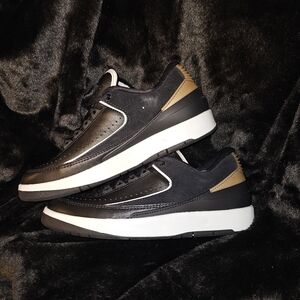 Size 10w- 24. Jordan 2 retro low black metallic gold